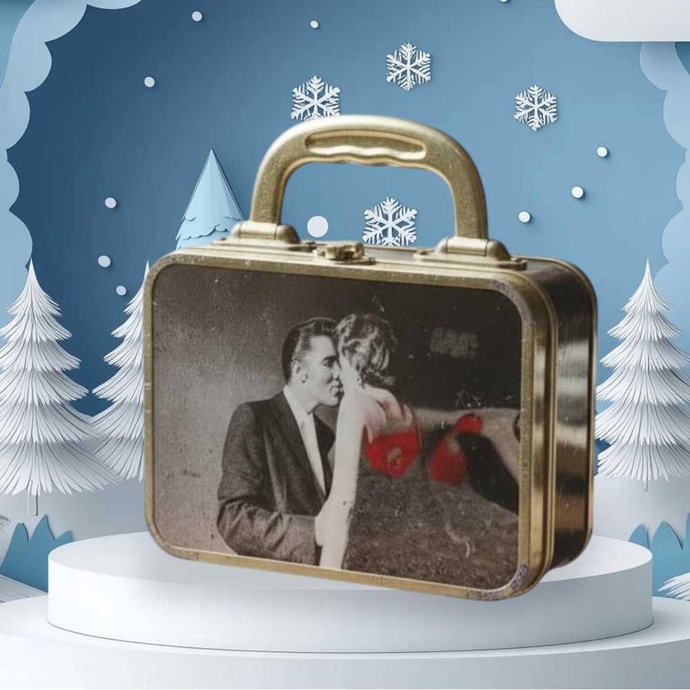 This black lunchbox or purse with pictures front and back of Elvis Presley